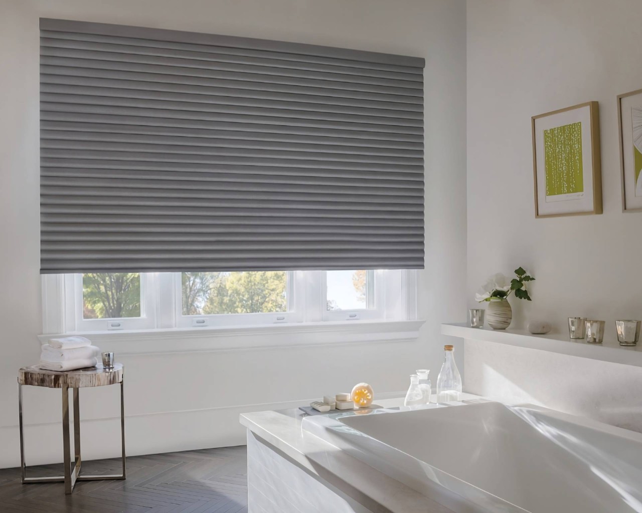 Hunter Douglas Sonnette® Roller Shades on a large window in a bathroom with a free-standing tub at Walls & Windows near Bellingham, WA