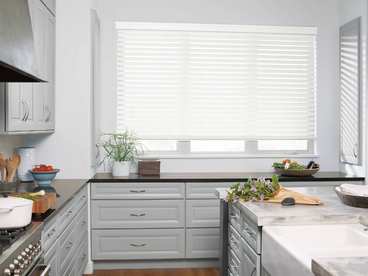 Hunter Douglas Everwood® Faux Wood Blinds on a kitchen window at Walls & Windows near Bellingham, WA