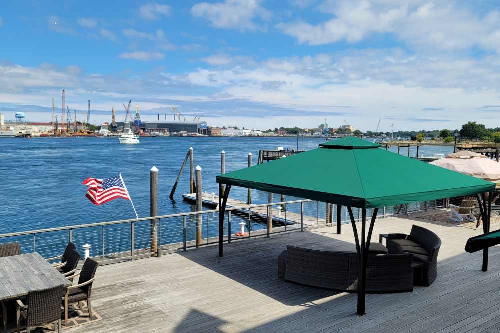 A green SummerSpace® Open Air Cabana mounted on a waterfront dock near Bellingham, Washington (WA)